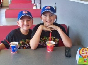 Hunter Piper, right, enjoys a Blizzard at DQ on Miracle Treat Day in 2010.